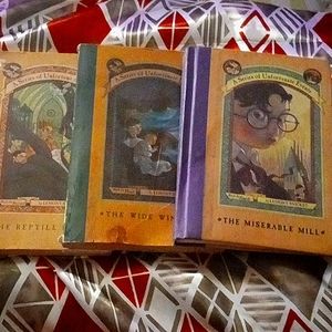 3 of the series of unfortunate events books, all a little damaged but not severe